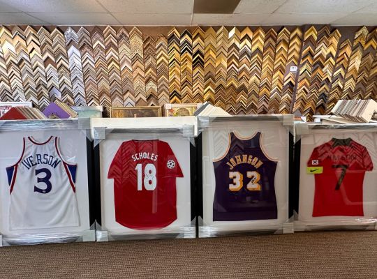 Sports memorabilia display with bat, photo, and custom plaque